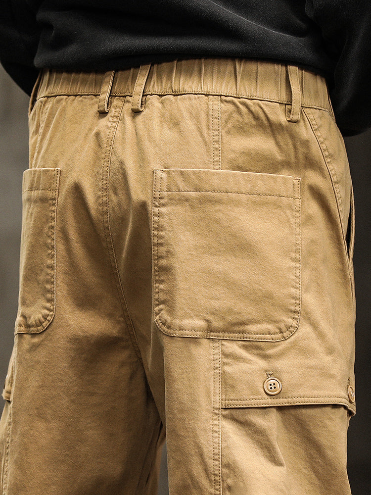 Pantalon cargo fuselé à taille élastiquée et boutons décoratifs pour homme