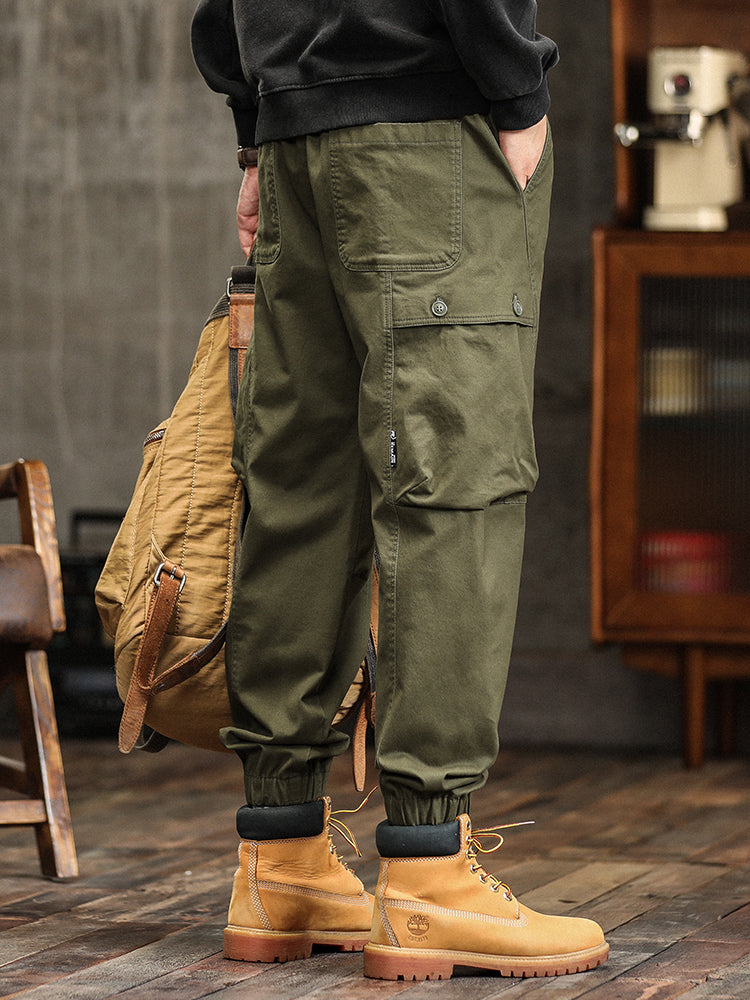 Pantalon cargo fuselé à taille élastiquée et boutons décoratifs pour homme