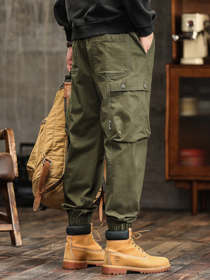 Pantalon cargo fuselé à taille élastiquée et boutons décoratifs pour homme