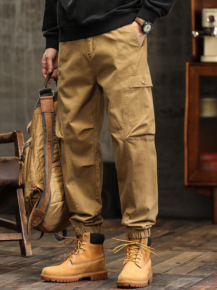 Pantalon cargo fuselé à taille élastiquée et boutons décoratifs pour homme