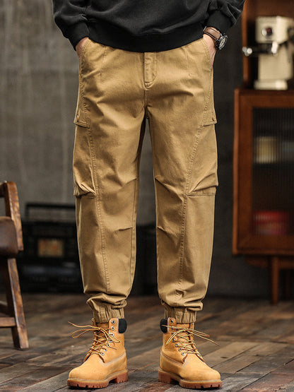 Pantalon cargo fuselé à taille élastiquée et boutons décoratifs pour homme