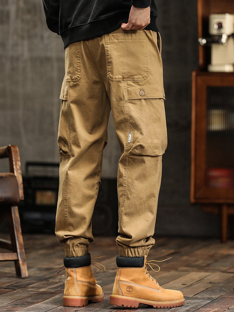 Pantalon cargo fuselé à taille élastiquée et boutons décoratifs pour homme