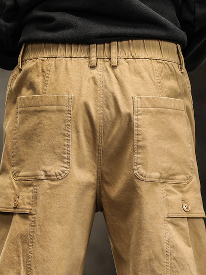 Pantalon cargo fuselé à taille élastiquée et boutons décoratifs pour homme