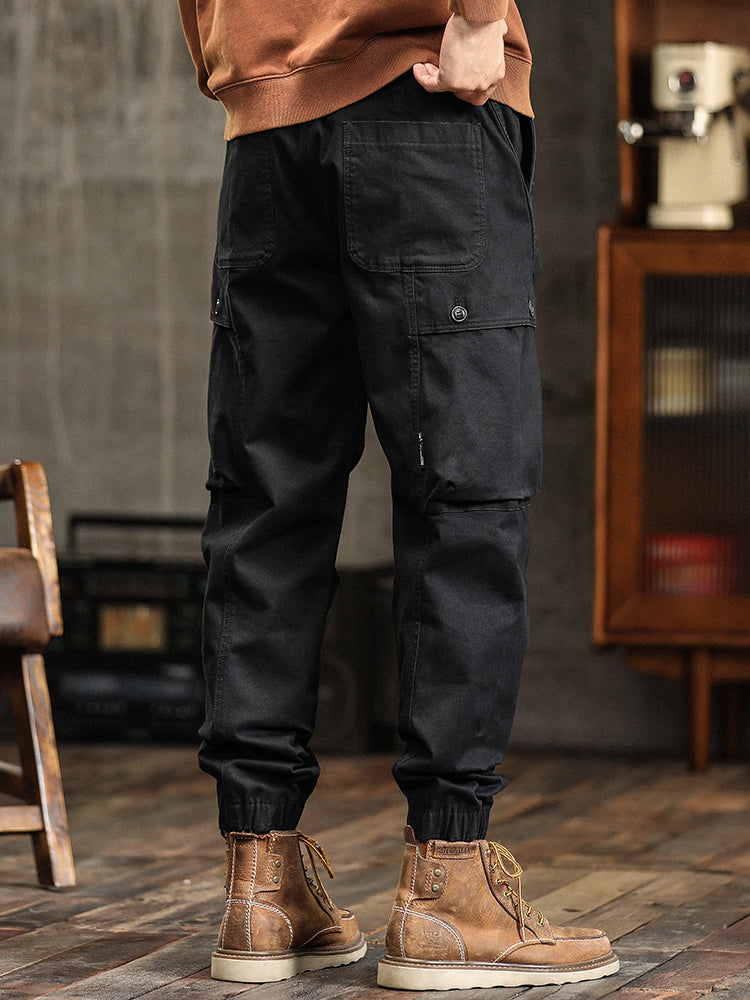 Pantalon cargo fuselé à taille élastiquée et boutons décoratifs pour homme