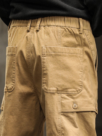 Pantalon cargo fuselé à taille élastiquée et boutons décoratifs pour homme