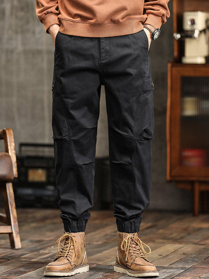 Pantalon cargo fuselé à taille élastiquée et boutons décoratifs pour homme