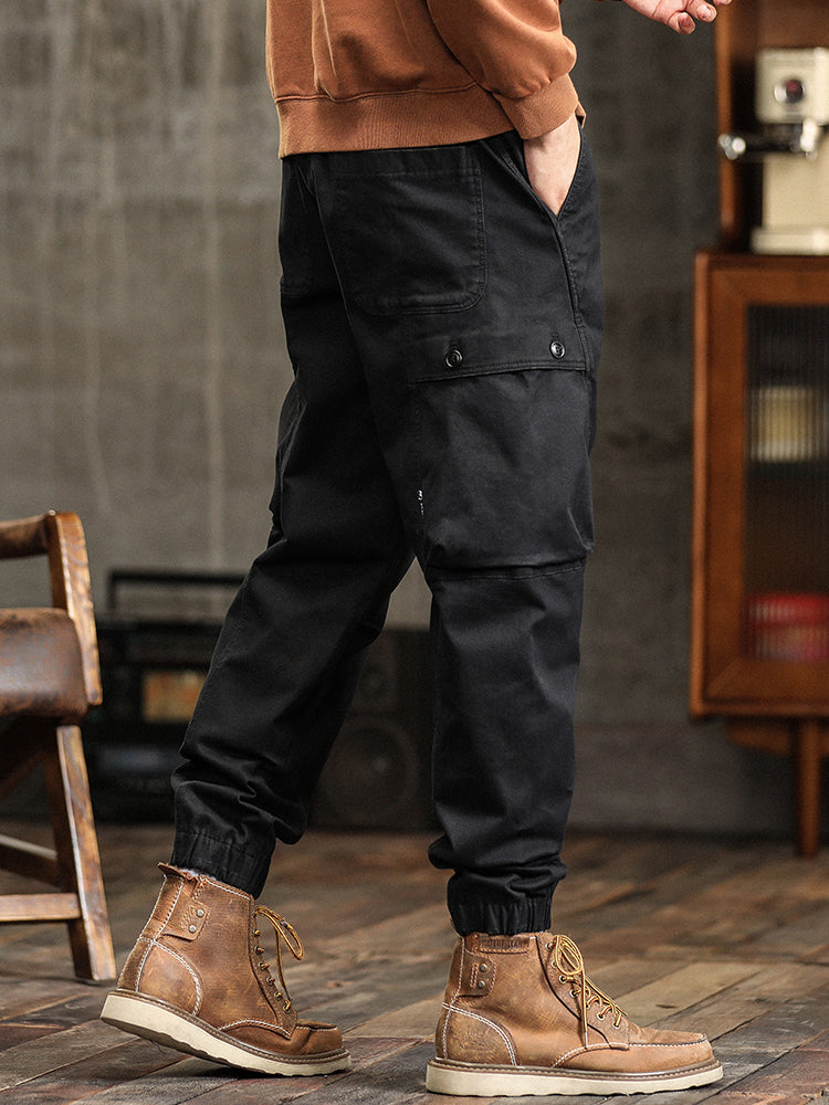 Pantalon cargo fuselé à taille élastiquée et boutons décoratifs pour homme